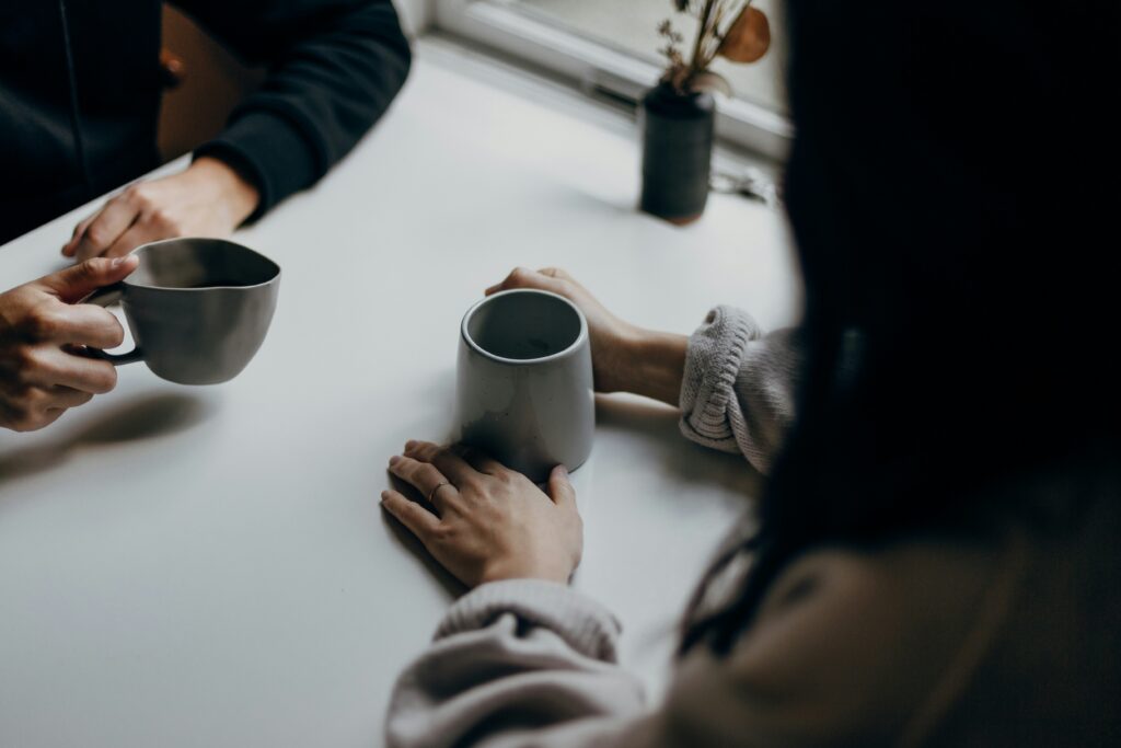 Two people meeting over coffee