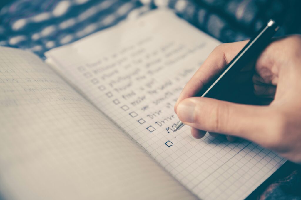 A person completing a checklist